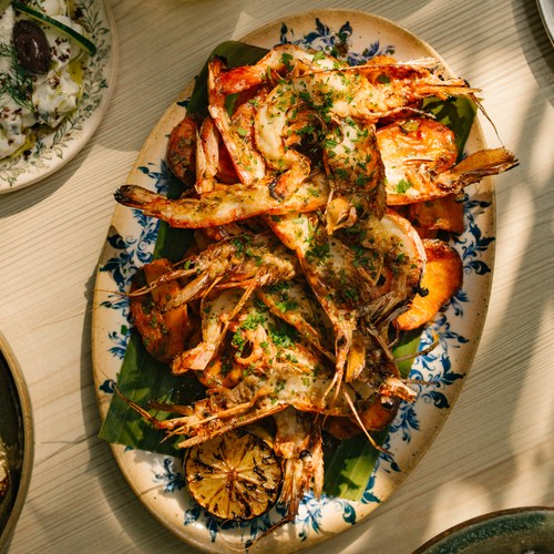 Roasted king prawns, batata harra, grilled lime, parsley, tzatziki