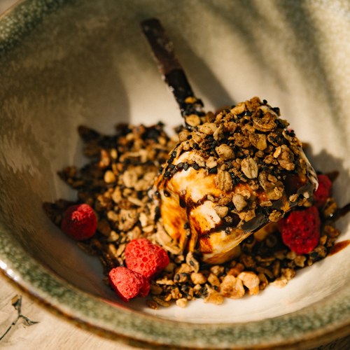 Fire-kissed marshmallow stuffed with chocolate rum ice cream, hazelnut raspberry dukkah